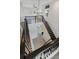 This entryway boasts a stunning chandelier and staircase with iron railings at 16112 Vetta Dr, Montverde, FL 34756