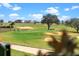 Picturesque golf course showcasing mature trees and well-maintained greens at 16112 Vetta Dr, Montverde, FL 34756