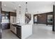 Modern kitchen featuring stainless steel appliances, a spacious island, and stylish pendant lighting at 16112 Vetta Dr, Montverde, FL 34756