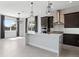 Open kitchen with stainless appliances, a center island, and an adjacent dining area with backyard views at 16112 Vetta Dr, Montverde, FL 34756