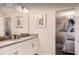 Bright bathroom featuring a double vanity and a glimpse into the Frozen-themed bedroom at 1656 Moon Valley Dr, Davenport, FL 33896