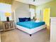 Inviting bedroom with a plush bed, stylish headboard, bedside tables, and bright windows at 1656 Moon Valley Dr, Davenport, FL 33896