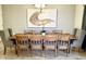 Elegant dining room featuring a large wooden table with seating for ten at 1656 Moon Valley Dr, Davenport, FL 33896