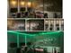 Game room with four monitors, gaming chairs, green neon and foosball table at 1656 Moon Valley Dr, Davenport, FL 33896