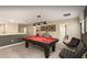 Upstairs game room with a pool table, seating, framed art, and access to more rooms at 1656 Moon Valley Dr, Davenport, FL 33896