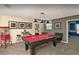Open game room featuring a billiards table, sleek furniture, carpet and pendant lighting at 1656 Moon Valley Dr, Davenport, FL 33896