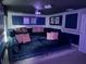 Stylish media room featuring comfortable seating, custom lighting, and elegant decor at 1656 Moon Valley Dr, Davenport, FL 33896