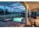 Inviting screened-in pool with connected hot tub, perfect for relaxation and entertaining at 1656 Moon Valley Dr, Davenport, FL 33896