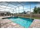 Beautiful clear pool surrounded by brick pavers and a screened-in enclosure at 1656 Moon Valley Dr, Davenport, FL 33896