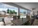 A covered patio provides scenic views of the pool and spa, great for outdoor gatherings and relaxation at 1656 Moon Valley Dr, Davenport, FL 33896