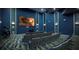 Private theater room with comfortable seating and a large screen, perfect for movie nights at 1656 Moon Valley Dr, Davenport, FL 33896