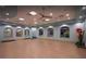 Bright yoga studio with large windows, ample space, and mirrors for a refreshing workout at 1656 Moon Valley Dr, Davenport, FL 33896
