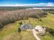 Aerial view of home with screened pool, work shed, and expansive yard at 1680 Blackwelder Rd, De Leon Springs, FL 32130