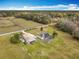 An expansive property features a house, barn, pool, and vast land at 1680 Blackwelder Rd, De Leon Springs, FL 32130