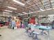 Spacious barn interior featuring a variety of tools, equipment, and ample workspace at 1680 Blackwelder Rd, De Leon Springs, FL 32130