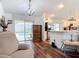 Relaxing living area with hardwood floors, an open concept, and pool access at 1680 Blackwelder Rd, De Leon Springs, FL 32130