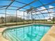 Inviting screened pool and spa with tranquil views of the backyard at 1680 Blackwelder Rd, De Leon Springs, FL 32130