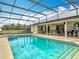 Inviting screened pool and spa with patio area at 1680 Blackwelder Rd, De Leon Springs, FL 32130