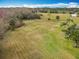 A spacious backyard presents lots of green space, ideal for relaxation or recreation at 1680 Blackwelder Rd, De Leon Springs, FL 32130