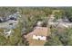 Aerial view of the home showcasing its roof, surrounding trees, and the neighborhood at 203 North E Blvd, Davenport, FL 33837
