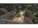 Aerial view of the property showcasing the home, surrounding landscape, and spacious lot at 203 North E Blvd, Davenport, FL 33837
