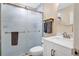 Modern bathroom featuring a glass-enclosed shower, sleek vanity, and updated fixtures at 203 North E Blvd, Davenport, FL 33837