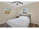 Inviting bedroom featuring a comfortable bed, plenty of natural light, and neutral tones at 203 North E Blvd, Davenport, FL 33837