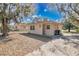 Charming single-story home featuring a well-maintained lawn and a cozy front entrance at 203 North E Blvd, Davenport, FL 33837
