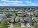 Aerial view of the property showcasing its location with lake and screened-in pool at 2107 Stone Cross Cir, Orlando, FL 32828