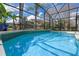 Beautiful screened-in pool with cool blue water and lush tropical landscaping at 2107 Stone Cross Cir, Orlando, FL 32828