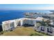 An aerial view of a waterfront condominium with a marina, offering picturesque views and convenient amenities at 225 W Seminole Blvd # 314, Sanford, FL 32771