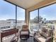 Relax on this balcony with comfortable wicker seating and lovely views through large windows at 225 W Seminole Blvd # 314, Sanford, FL 32771