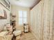 Bathroom with a tiled floor, window with blinds, and a shower-tub combination at 225 W Seminole Blvd # 314, Sanford, FL 32771