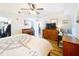 Comfortable bedroom featuring a ceiling fan, hardwood floors, and a nautical-themed comforter at 225 W Seminole Blvd # 314, Sanford, FL 32771