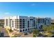 Luxury condo building featuring ample parking, a waterfront view, and an outdoor patio area at 225 W Seminole Blvd # 314, Sanford, FL 32771