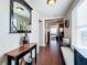 Elegant hallway with hardwood floors, decorative mirror, and tasteful decor leading to various rooms at 225 W Seminole Blvd # 314, Sanford, FL 32771