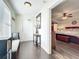 Inviting hallway with beautiful hardwood floors, stylish décor, and access to the bedroom at 225 W Seminole Blvd # 314, Sanford, FL 32771