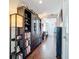 Hallway featuring dark wood floors and a bookcase at 225 W Seminole Blvd # 314, Sanford, FL 32771