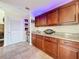 Kitchen with wooden cabinets and granite countertops at 225 W Seminole Blvd # 314, Sanford, FL 32771