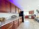 Spacious kitchen featuring wooden cabinets and a stainless steel refrigerator at 225 W Seminole Blvd # 314, Sanford, FL 32771