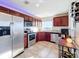 The kitchen features cherry cabinets, stainless steel appliances, and a granite countertop at 225 W Seminole Blvd # 314, Sanford, FL 32771
