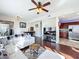 Living room features modern lighting, wood floors and kitchen access at 225 W Seminole Blvd # 314, Sanford, FL 32771