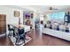 Open-concept living room with balcony and hardwood floors at 225 W Seminole Blvd # 314, Sanford, FL 32771