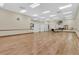 Spacious activity room with hardwood floors and a mirrored wall at 2308 Edmonton Ct, Clermont, FL 34711