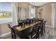 Formal dining area with a dark wood table, seating for eight, and decorative centerpieces at 2317 Distant Sun Trl, Kissimmee, FL 34747