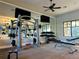 Well-equipped gym featuring weight machines, dumbbells, and a mirrored wall, perfect for a comprehensive workout at 2600 Avian Loop, Kissimmee, FL 34741