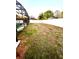 Spacious backyard featuring a screen enclosed pool, patio, and a privacy fence at 2655 Sheila Dr, Apopka, FL 32712