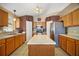 Kitchen featuring wood cabinets, stainless steel appliances, and island at 2655 Sheila Dr, Apopka, FL 32712