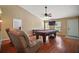 Spacious living room with hardwood floors and pool table at 2655 Sheila Dr, Apopka, FL 32712