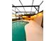 Beautiful in-ground pool under screened enclosure with spacious deck and outdoor lighting at 2655 Sheila Dr, Apopka, FL 32712